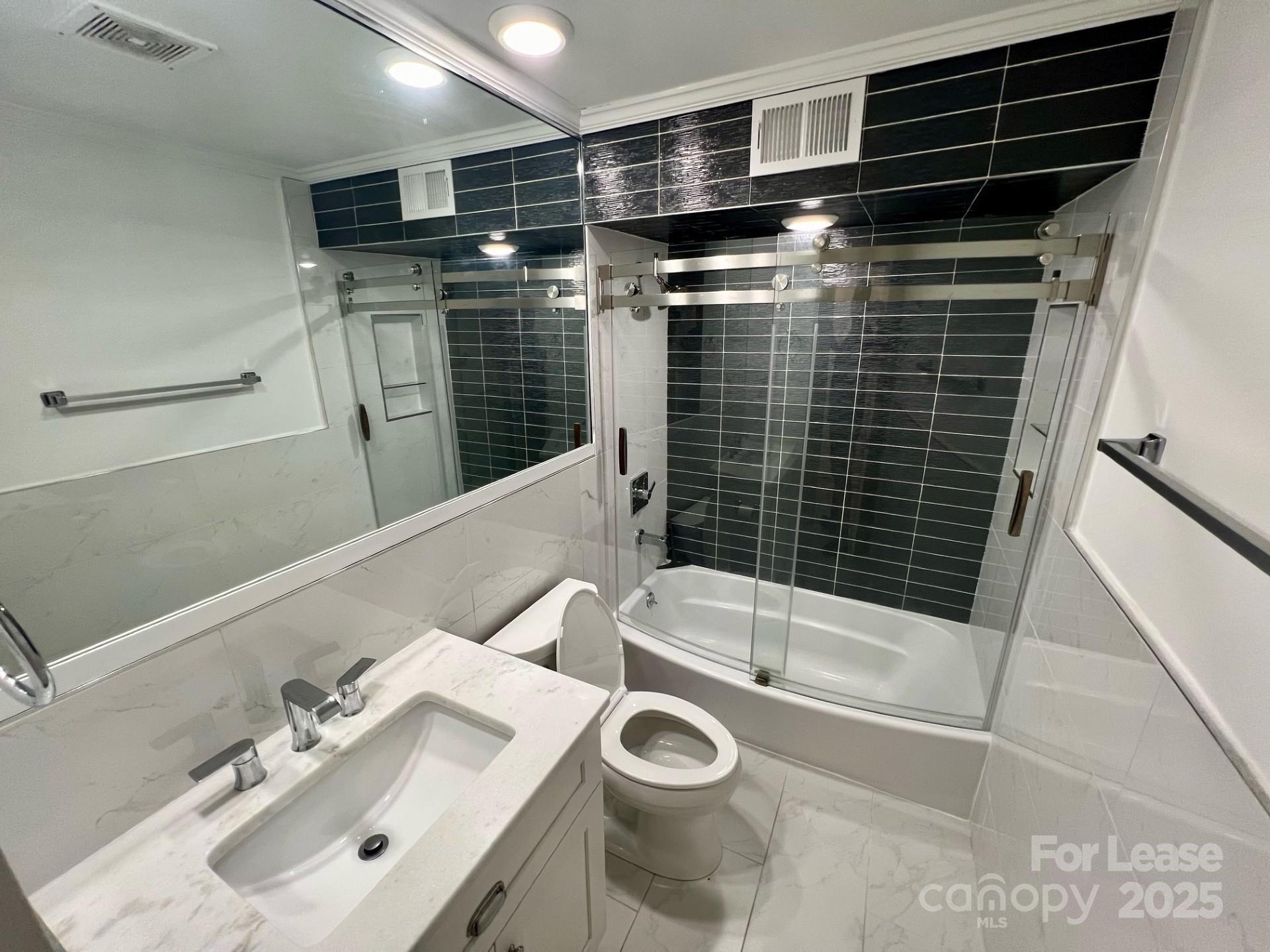 400 Queens Road, Unit B4 Charlotte, NC 28207 - Photo 5 of 10 a bathroom with a sink toilet and shower