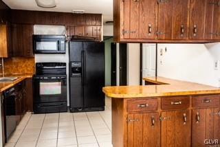 2825 Middletown Road Bethlehem, PA 18020 - Photo 23 of 28 a kitchen with granite countertop a refrigerator and a sink