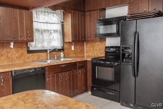 2825 Middletown Road Bethlehem, PA 18020 - Photo 24 of 28 a kitchen with stainless steel appliances granite countertop a refrigerator and a sink