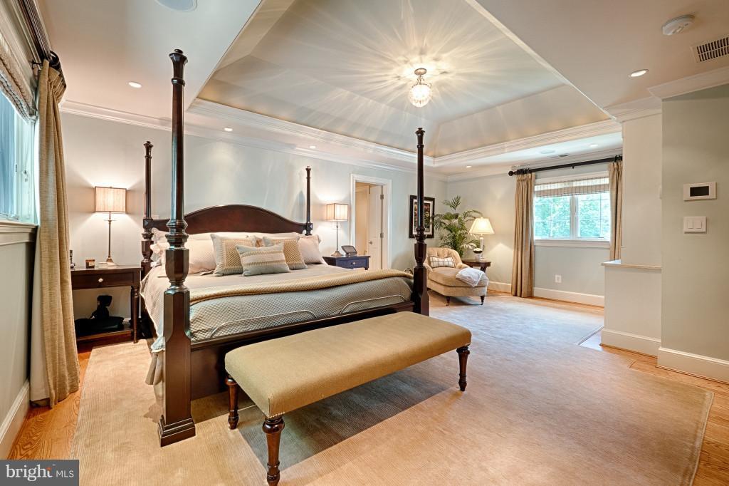 1301 Sawbridge Way Reston, VA 20194 - Photo 15 of 30 a bedroom with furniture and a chandelier