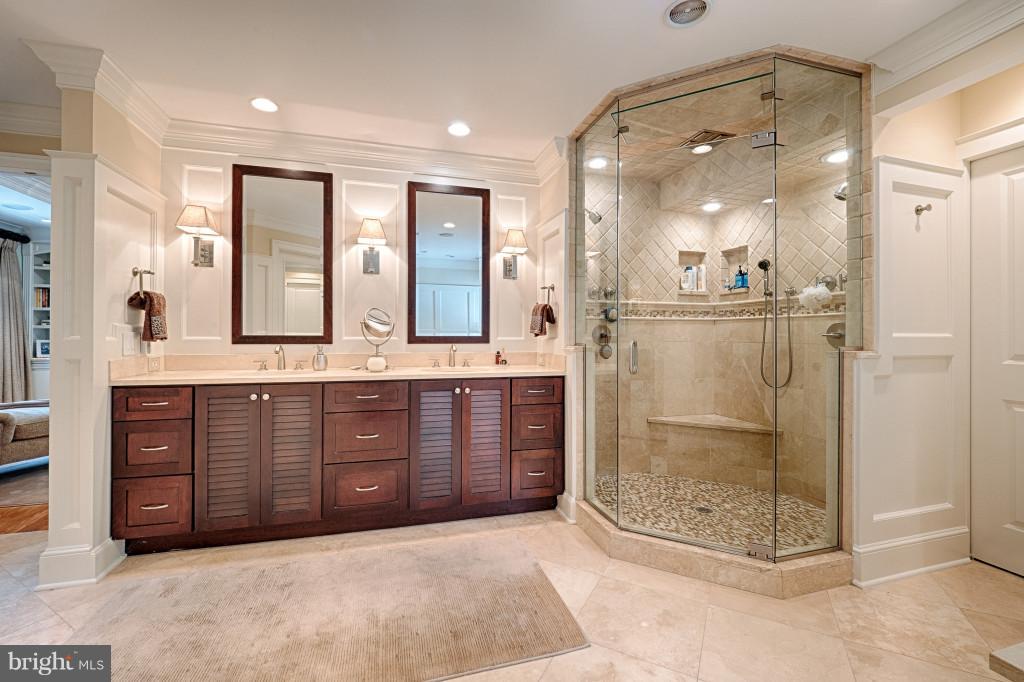 1301 Sawbridge Way Reston, VA 20194 - Photo 17 of 30 a bathroom with a granite countertop sink mirror and shower