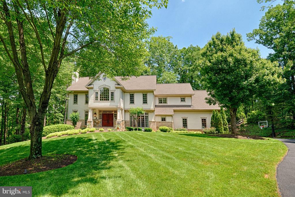 1301 Sawbridge Way Reston, VA 20194 - Photo 3 of 30 a view of a house with a big yard and large trees