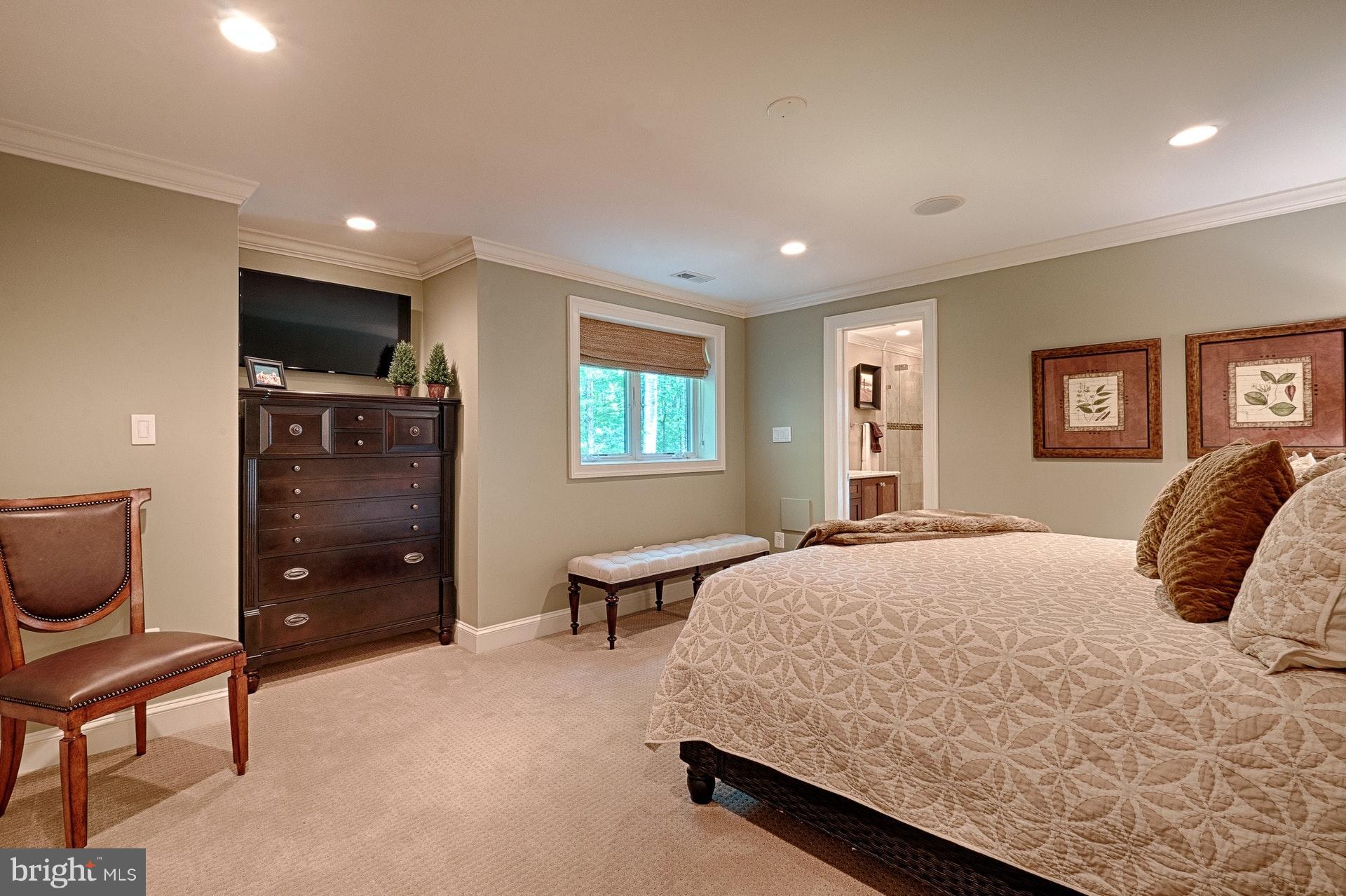 1301 Sawbridge Way Reston, VA 20194 - Photo 27 of 30 a bedroom with a bed and wooden floor