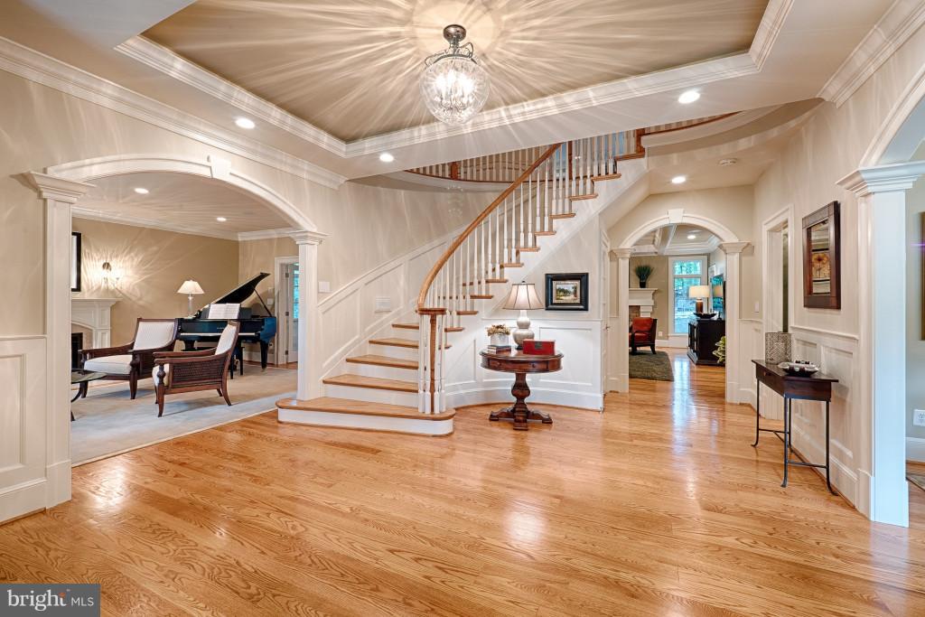 1301 Sawbridge Way Reston, VA 20194 - Photo 4 of 30 a view of an entryway dining room and hall with wooden floor