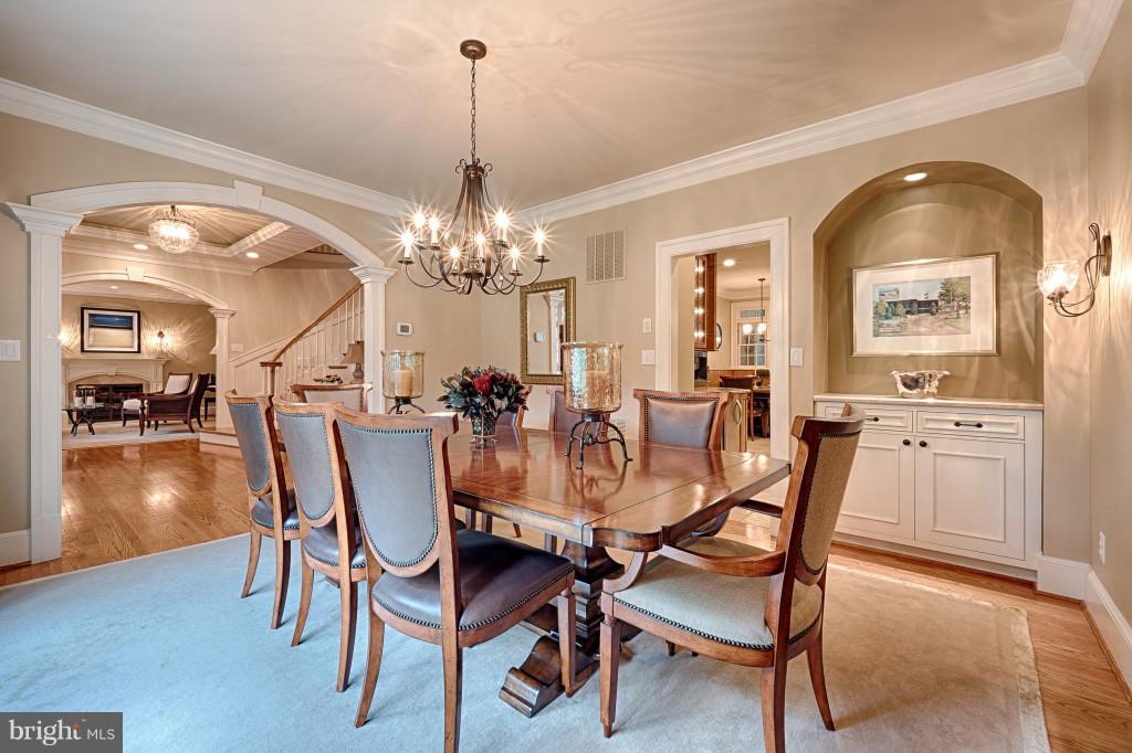 1301 Sawbridge Way Reston, VA 20194 - Photo 6 of 30 a view of a dining room with furniture and chandelier