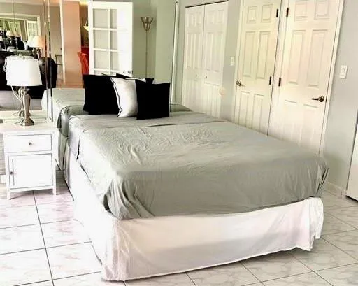 a living room with a couch and a dresser