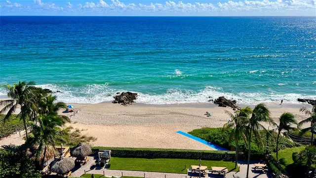 a view of a lake with a big yard