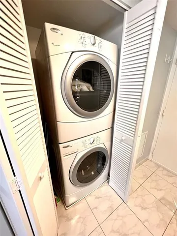 a close up view of a washer and dryer in a balcony