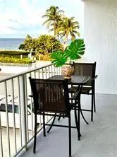 a view of a chairs and table on the terrace