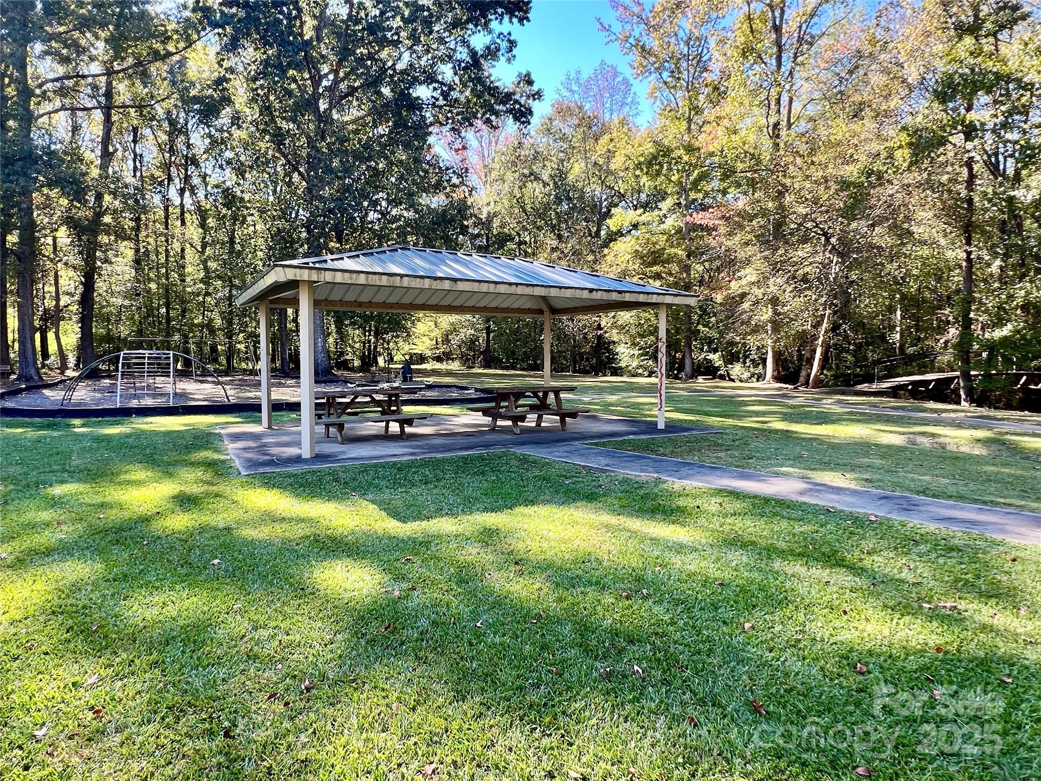 0 Riveroak Lane Lancaster, SC 29720 - Photo 20 of 22 a view of a swimming pool with lawn chairs and a big yard