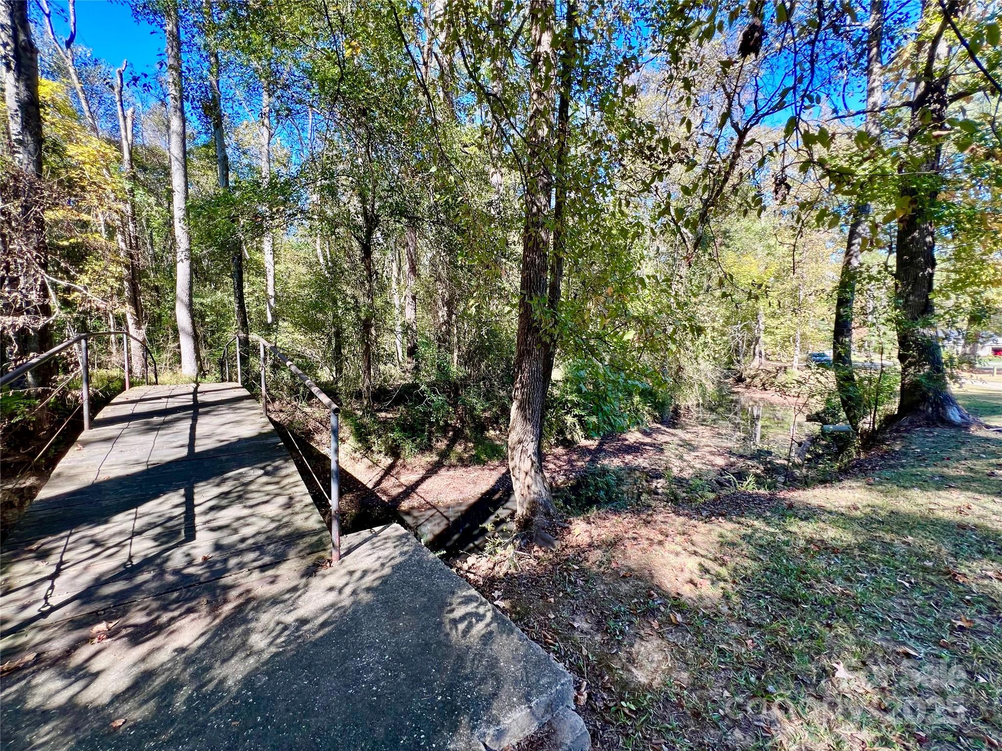 0 Riveroak Lane Lancaster, SC 29720 - Photo 8 of 22 a bench sitting in the middle of a forest
