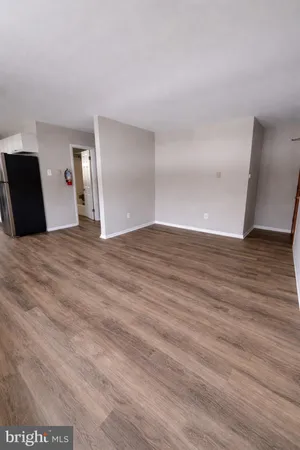 a view of a livingroom with wooden floor