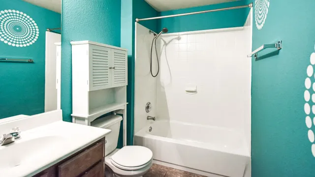 a bathroom with a window and shower