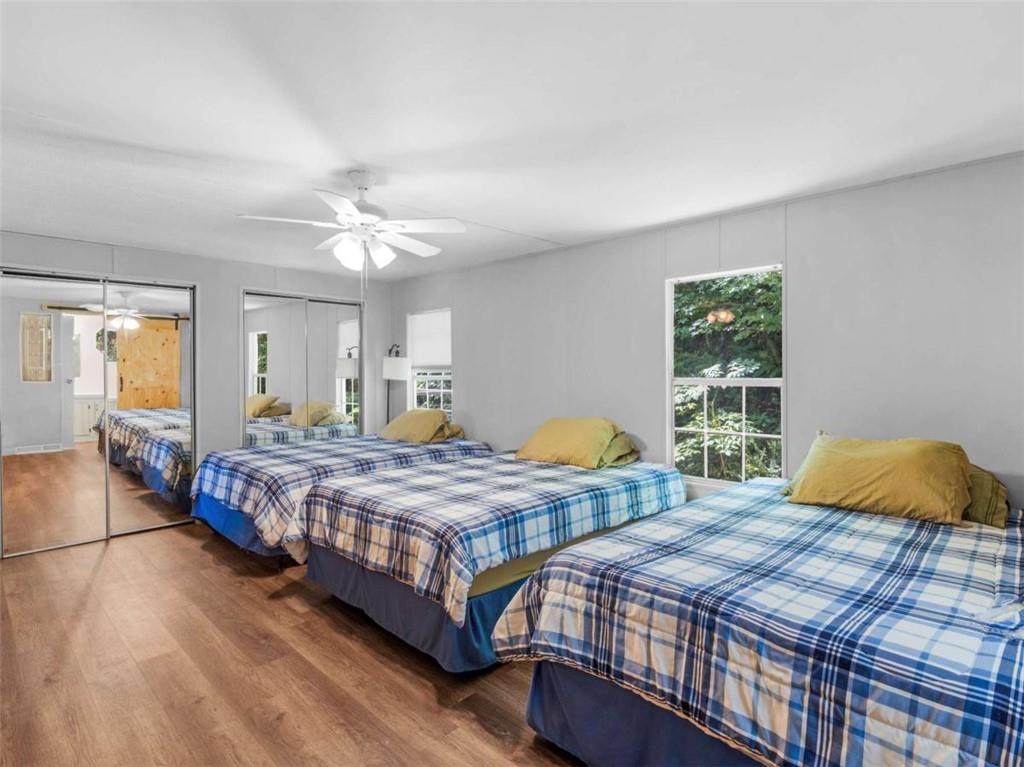 1775 Long Piney Road Mansfield, GA 30055 - Photo 11 of 26 a bedroom with two beds and a large window