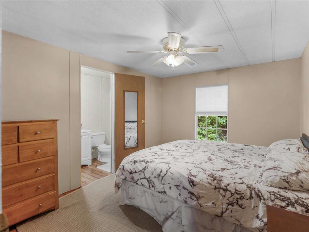 1775 Long Piney Road Mansfield, GA 30055 - Photo 13 of 26 a bedroom with a bed and a window