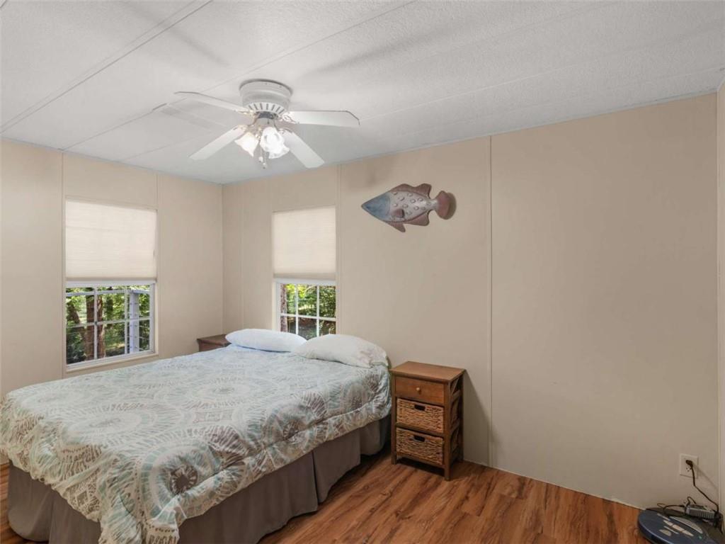1775 Long Piney Road Mansfield, GA 30055 - Photo 14 of 26 a bedroom with a bed and a chandelier