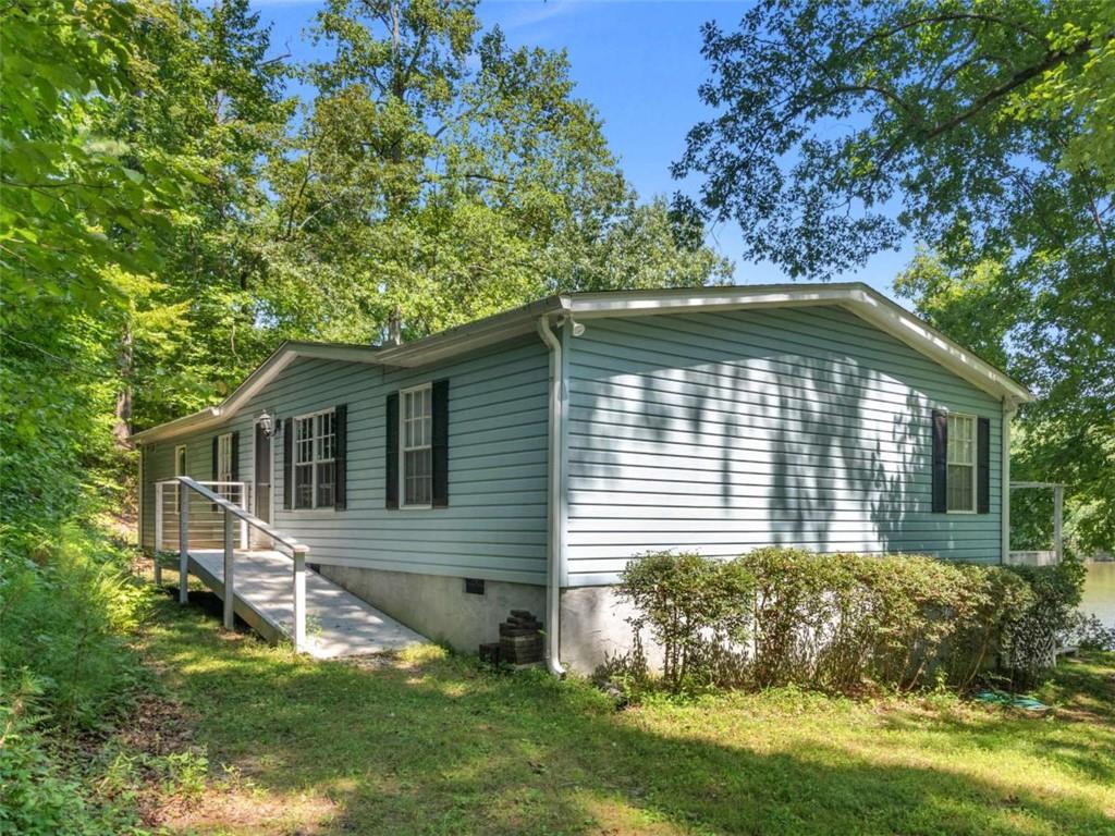 1775 Long Piney Road Mansfield, GA 30055 - Photo 2 of 26 a view of house with backyard