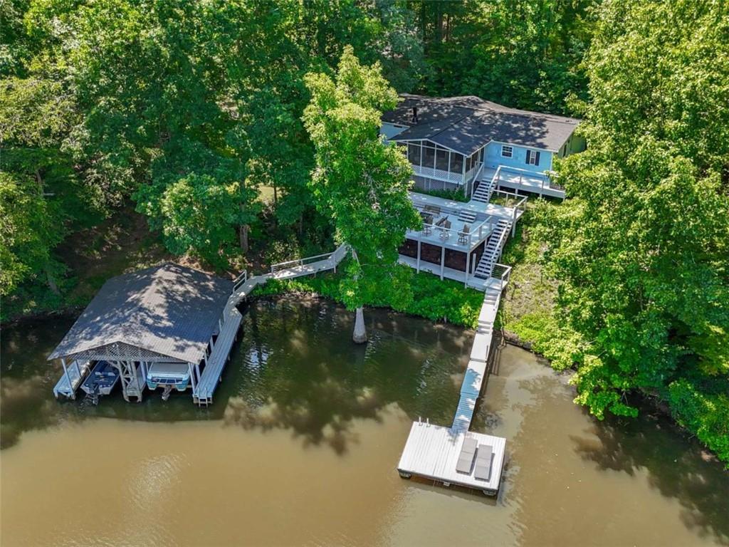 1775 Long Piney Road Mansfield, GA 30055 - Photo 24 of 26 a view of a house with a yard and a large tree