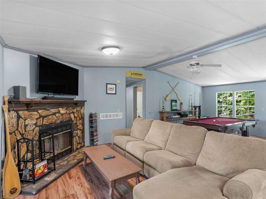 1775 Long Piney Road Mansfield, GA 30055 - Photo 4 of 26 a living room with furniture and a flat screen tv