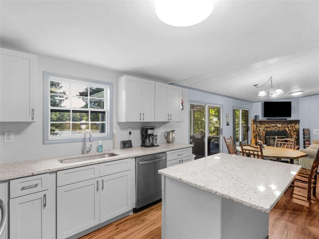 1775 Long Piney Road Mansfield, GA 30055 - Photo 8 of 26 a kitchen with stainless steel appliances a sink stove and cabinets