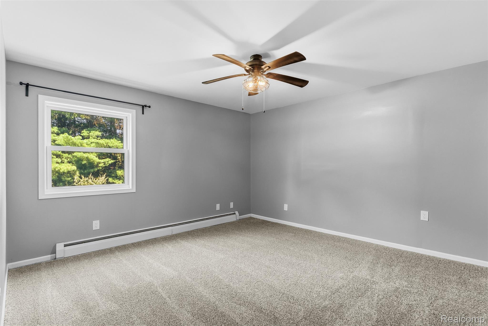 9200 Hickory Ridge Road Holly, MI 48442 - Photo 22 of 33 Spacious room featuring neutral carpeting and light gray walls