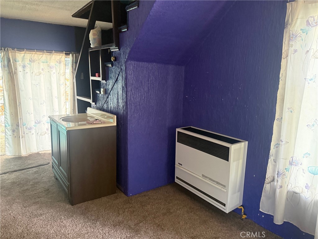 744 Woodland Road Crestline, CA 92325 - Photo 8 of 26 a utility room with dryer and washer