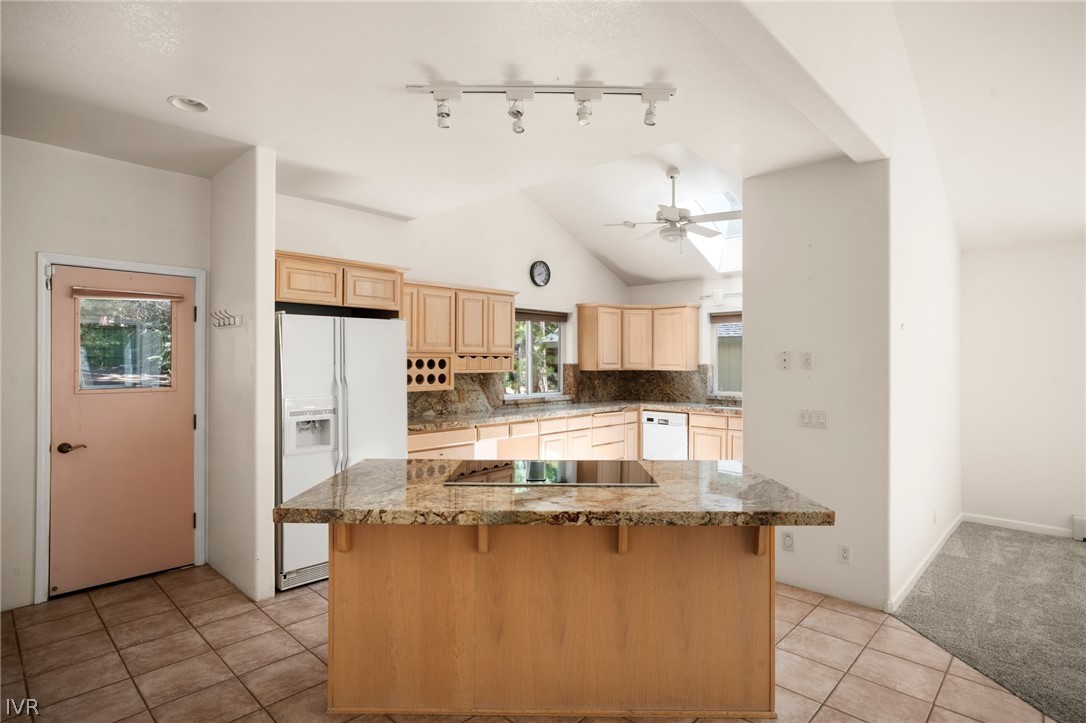 1094 Mill Creek Road Incline Village, NV 89451 - Photo 12 of 32 a view of a kitchen with kitchen island a sink wooden floor and counter top space