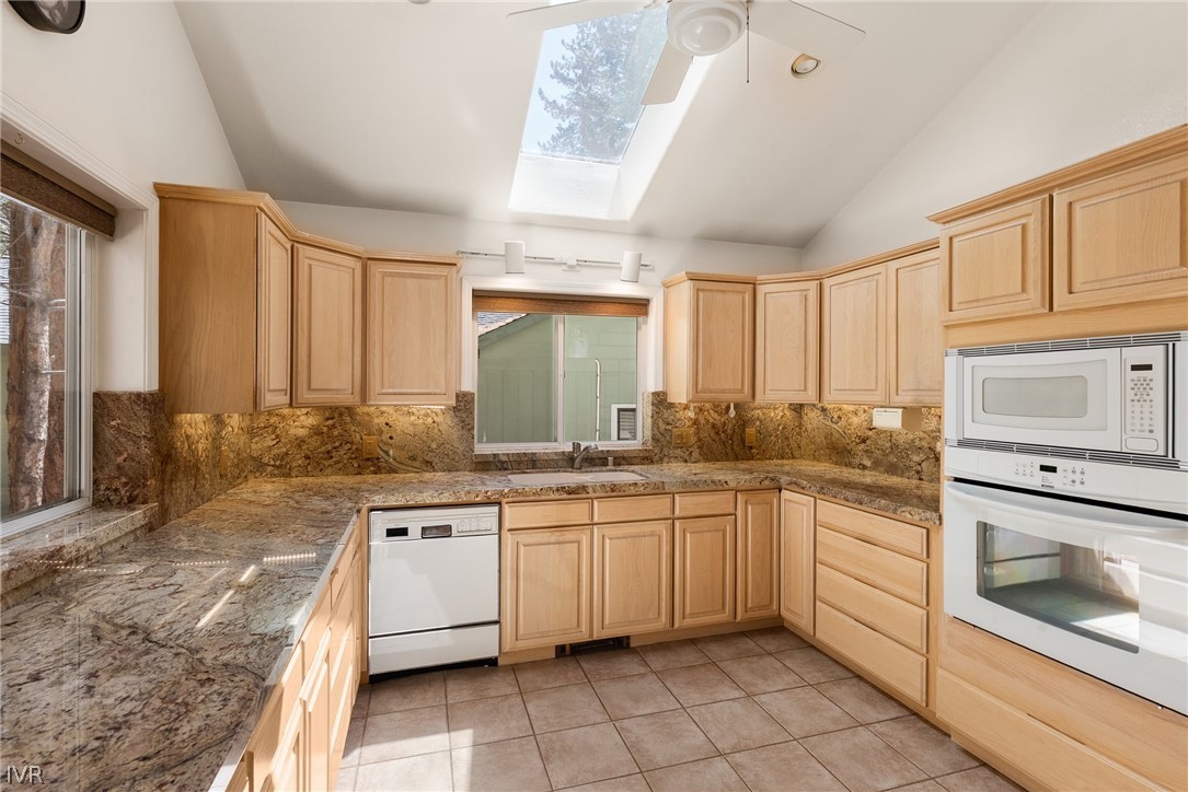 1094 Mill Creek Road Incline Village, NV 89451 - Photo 15 of 32 a kitchen with a sink stove and cabinets