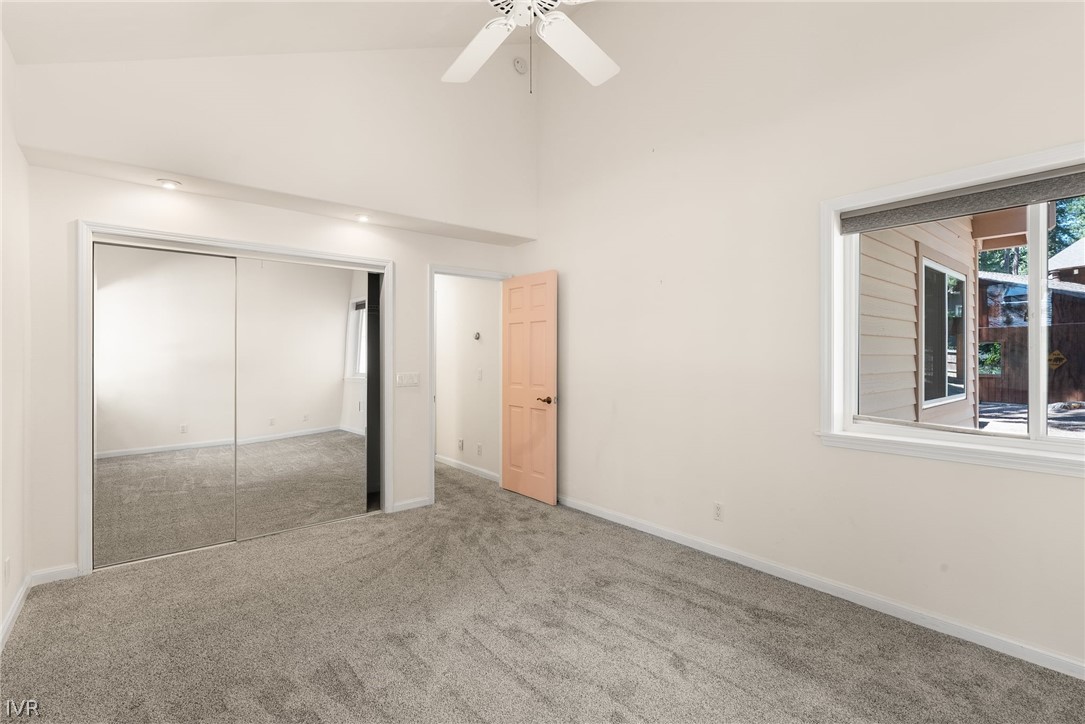 1094 Mill Creek Road Incline Village, NV 89451 - Photo 23 of 32 an empty room with a ceiling fan and a window