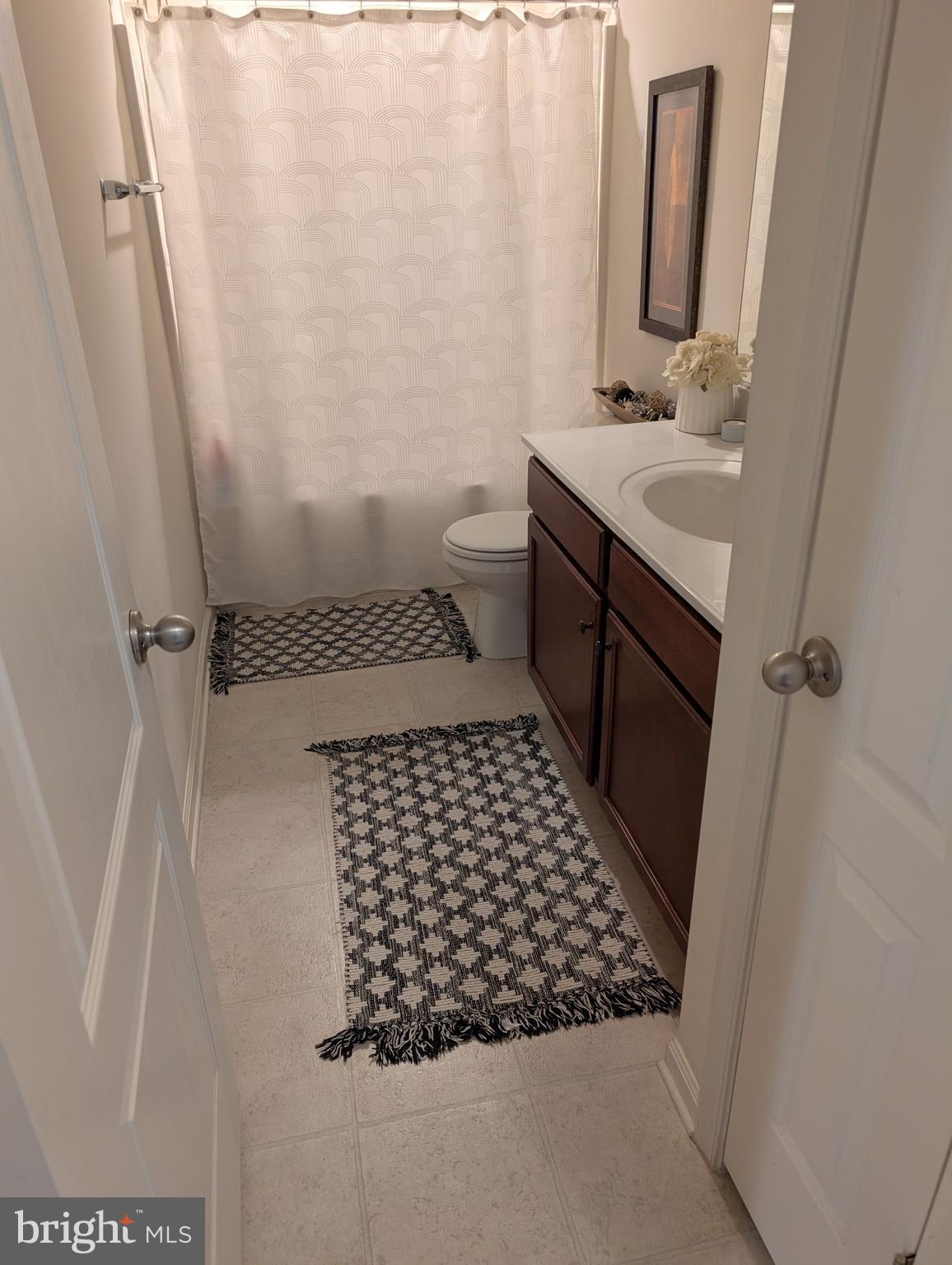 13944 Seneca Ridge Drive Hagerstown, MD 21740 - Photo 17 of 27 a bathroom with a sink and a mirror