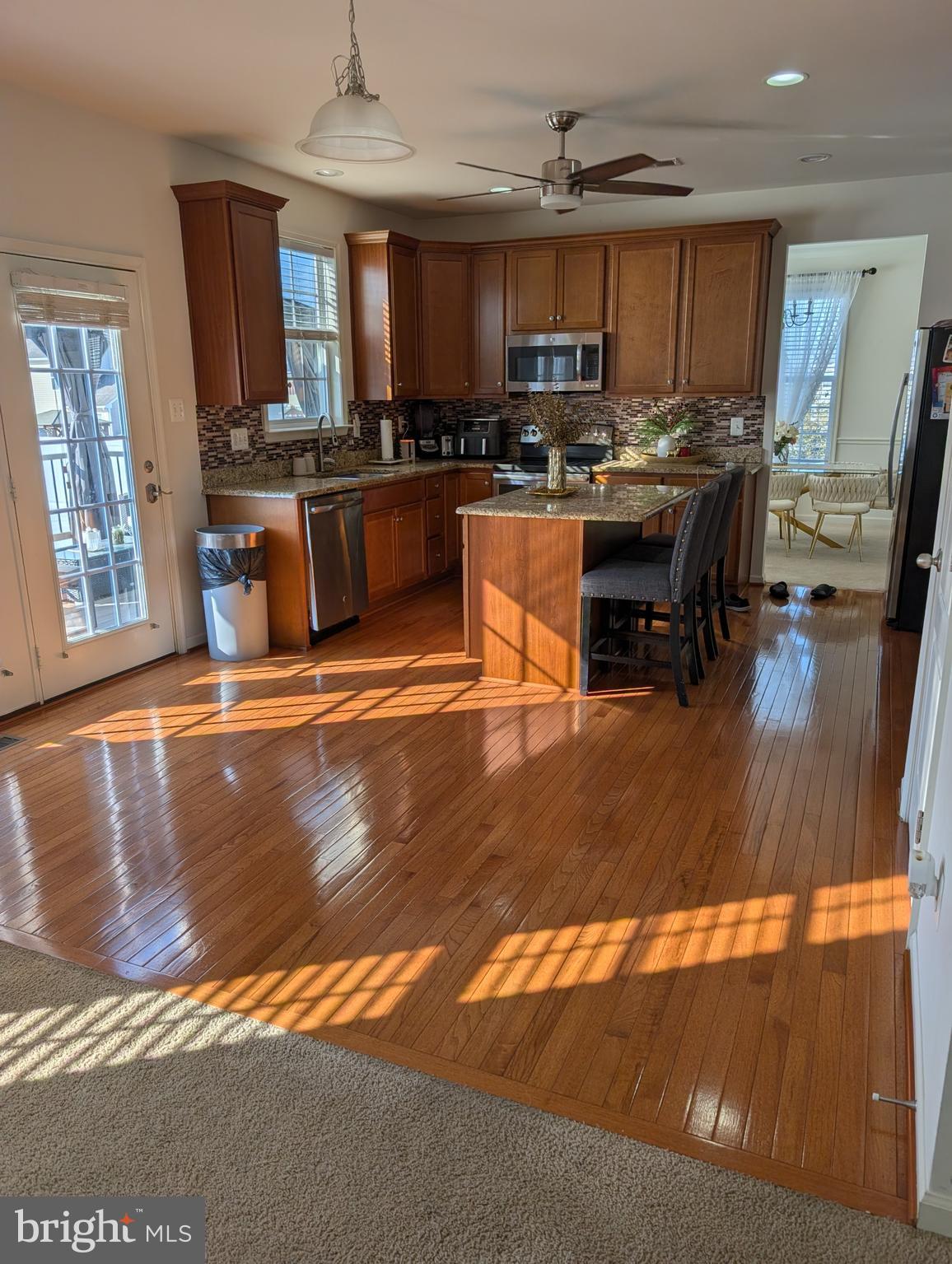 13944 Seneca Ridge Drive Hagerstown, MD 21740 - Photo 2 of 27 a kitchen with stainless steel appliances granite countertop a stove refrigerator and cabinets