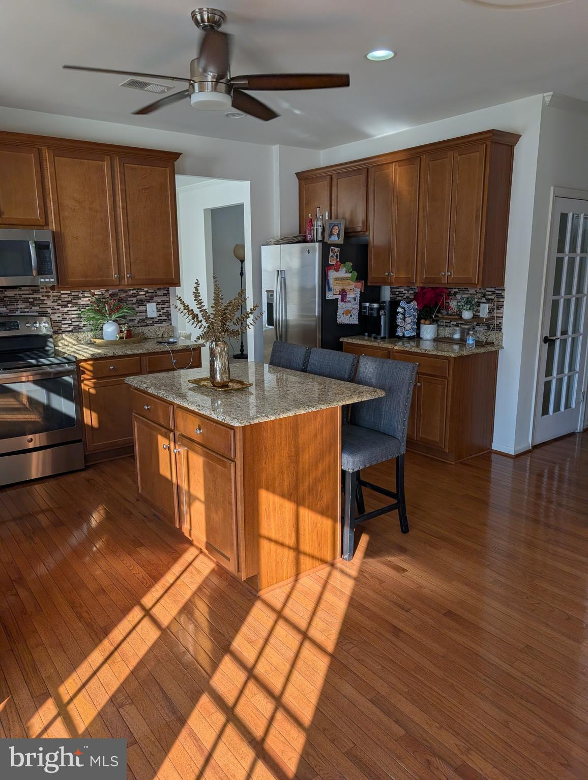 13944 Seneca Ridge Drive Hagerstown, MD 21740 - Photo 3 of 27 a kitchen with stainless steel appliances granite countertop a stove a sink and a refrigerator