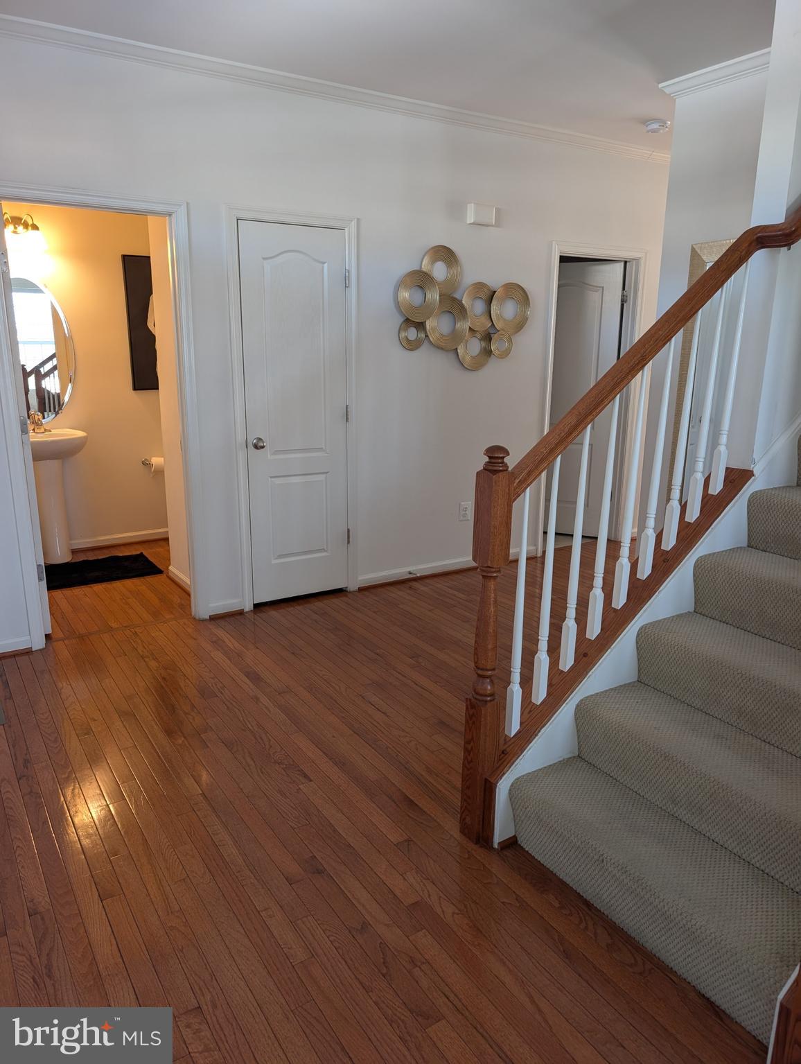 13944 Seneca Ridge Drive Hagerstown, MD 21740 - Photo 9 of 27 a view of entryway with stairs and wooden floor