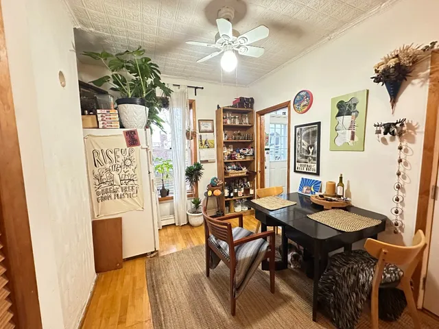 a view of a workspace with furniture and a kitchen