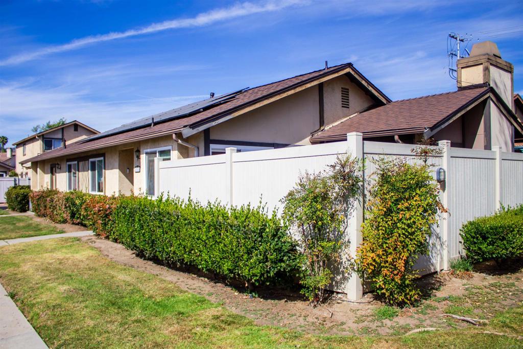 10385 Seth Way Santee, CA 92071 - Photo 7 of 33 a front view of a house with garden