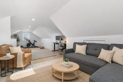 a living room with furniture and a table