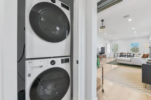 a view of a hallway with washer and dryer
