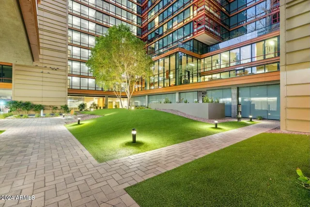 a view of a building with a backyard