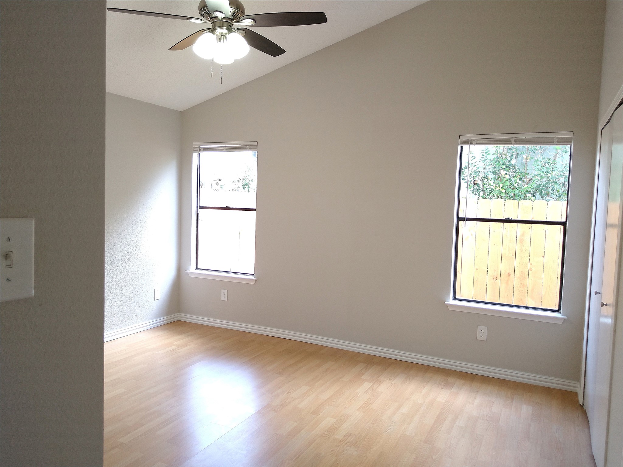 1813 Laurel Path Round Rock, TX 78664 - Photo 23 of 35 A quiet bedroom featuring vaulted ceilings and abundant natural light.