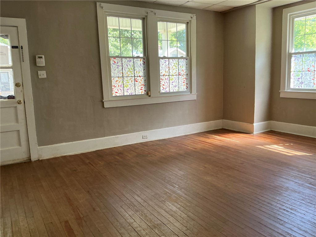 14 Ames Street Seneca, SC 29678 - Photo 4 of 15 Bright and airy room with gleaming hardwood floors.