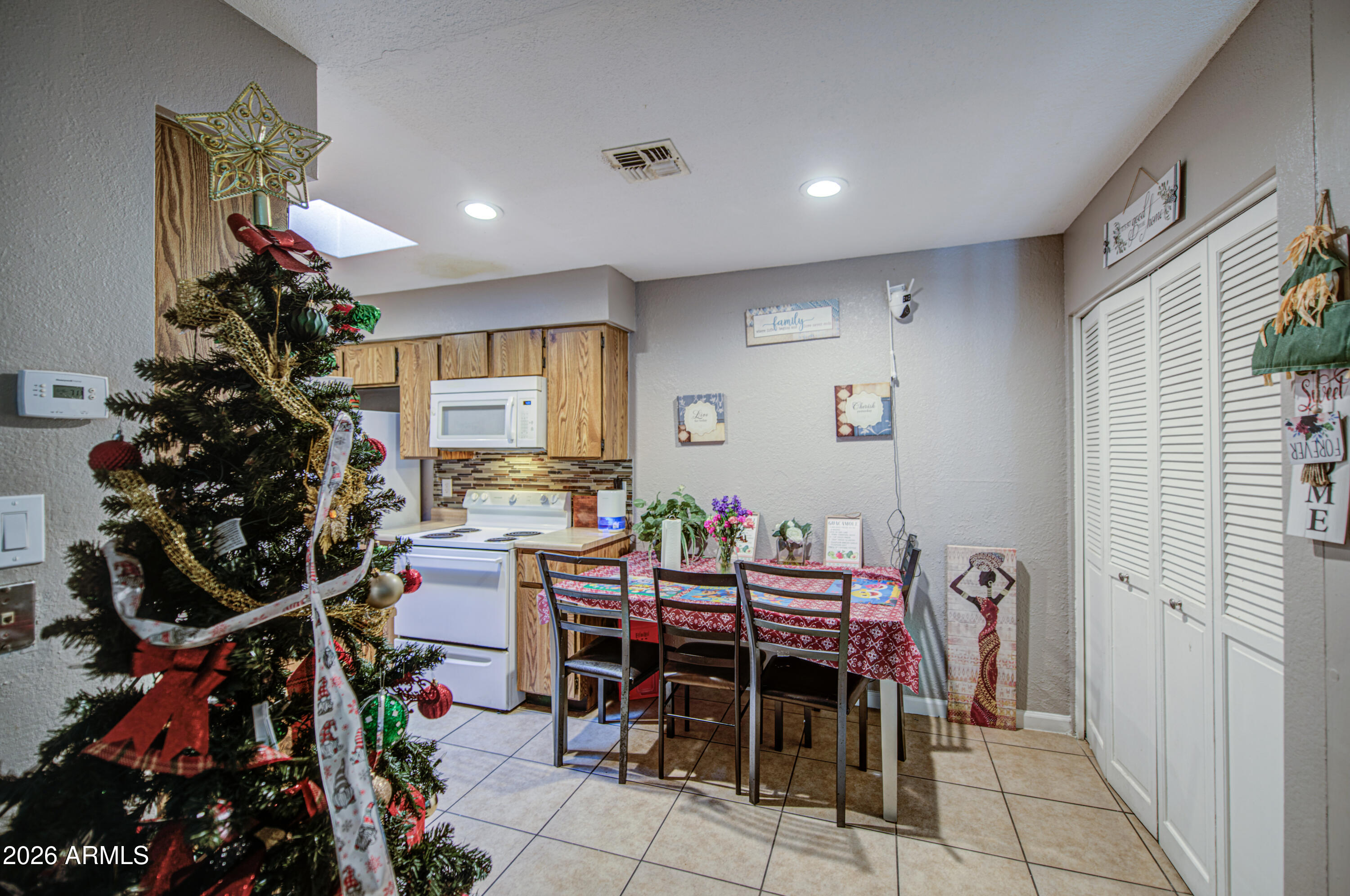 9009 West Elm Street, Unit 6 Phoenix, AZ 85037 - Photo 8 of 23 a view of a dining room with furniture