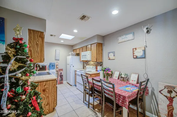 a view of a dining room with furniture and a potted plant
