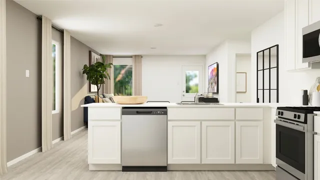 a kitchen with white cabinets and white appliances