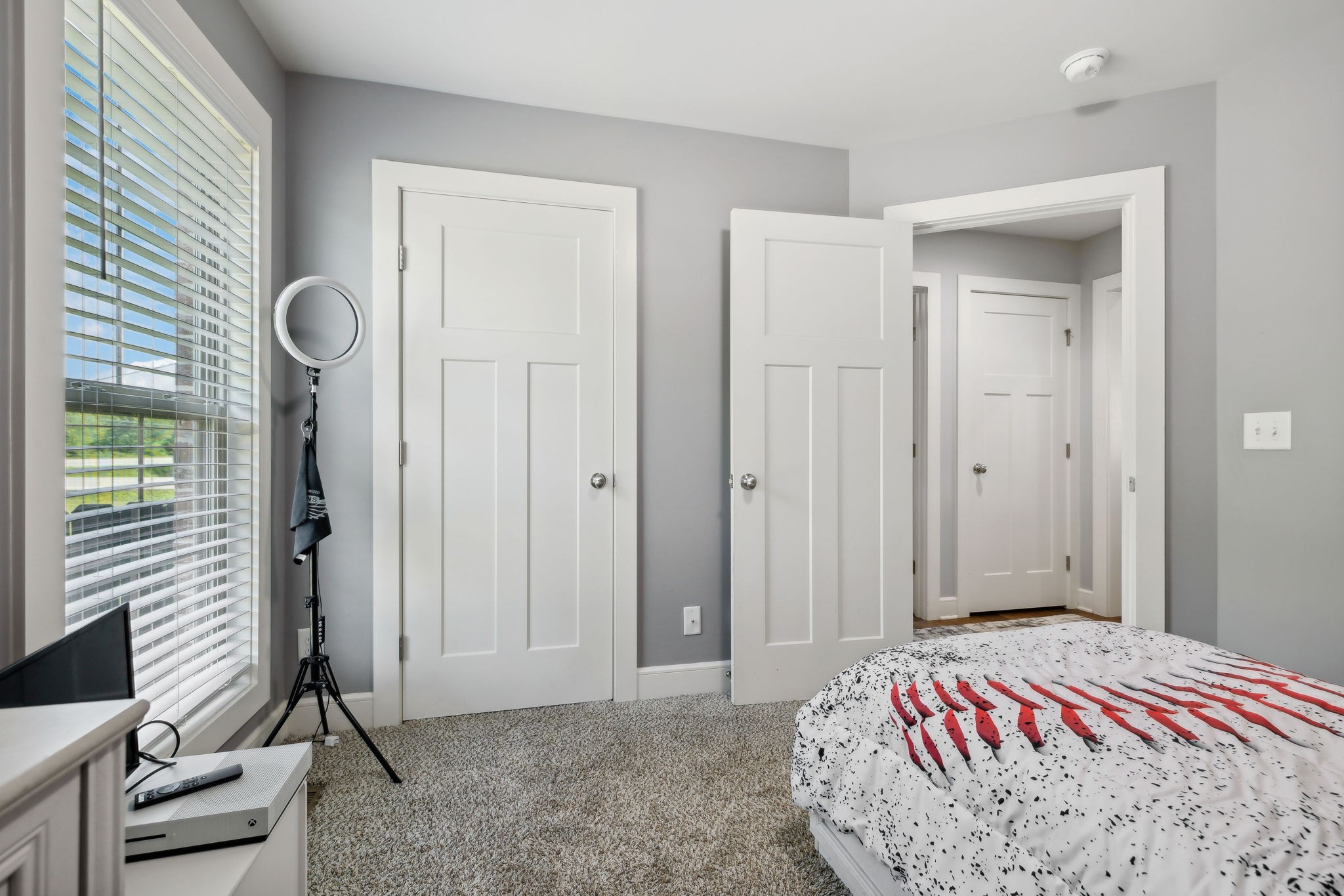 101 Flat Woods Road Lebanon, TN 37090 - Photo 36 of 55 a bedroom with a bed and a chandelier