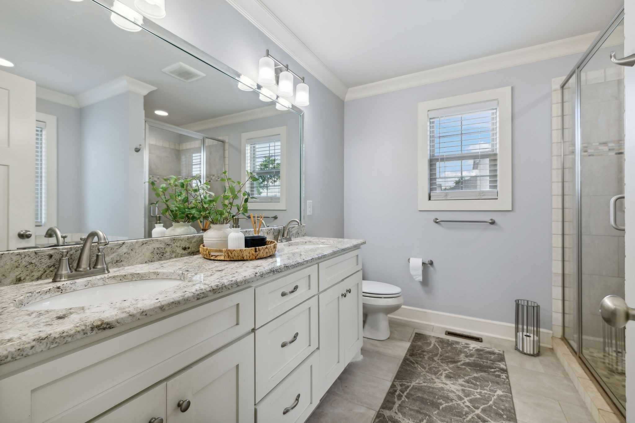 101 Flat Woods Road Lebanon, TN 37090 - Photo 39 of 55 a bathroom with a granite countertop sink mirror vanity and toilet