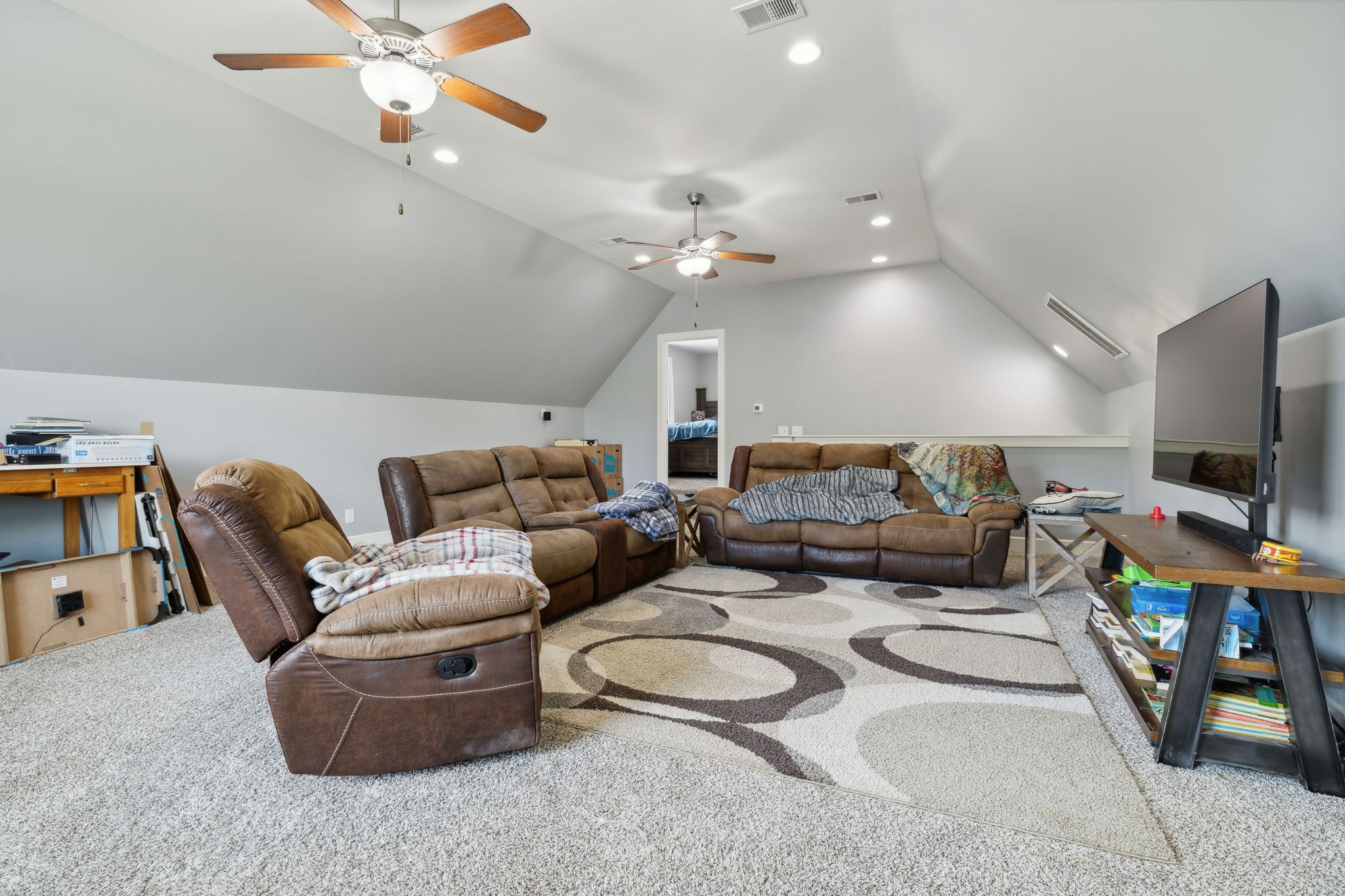 101 Flat Woods Road Lebanon, TN 37090 - Photo 43 of 55 a living room with furniture a flat screen tv and a chandelier