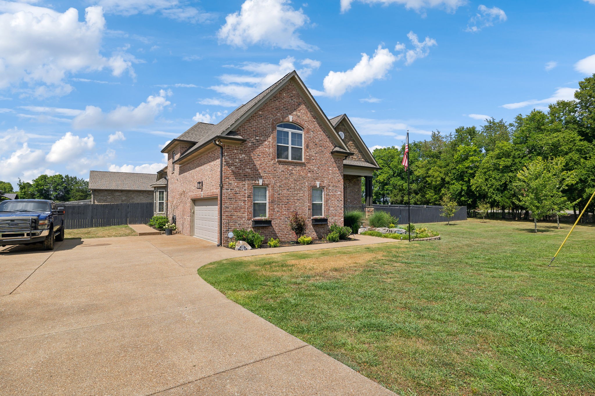 101 Flat Woods Road Lebanon, TN 37090 - Photo 7 of 55 a front view of a house with a yard and garage