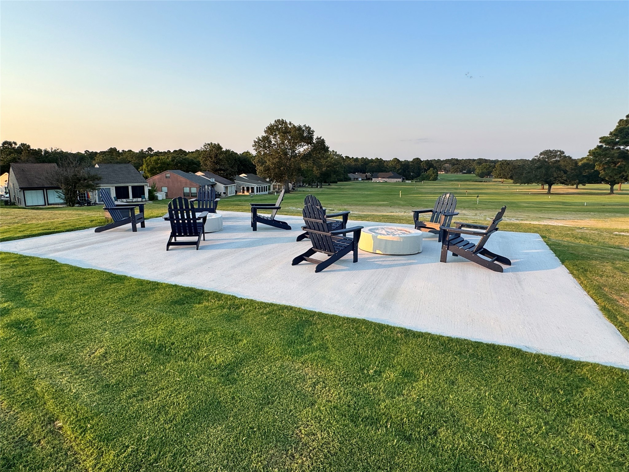 106 Westlake Road Trinity, TX 75862 - Photo 26 of 36 Recently added patio with burn pit overlooking the driving range!