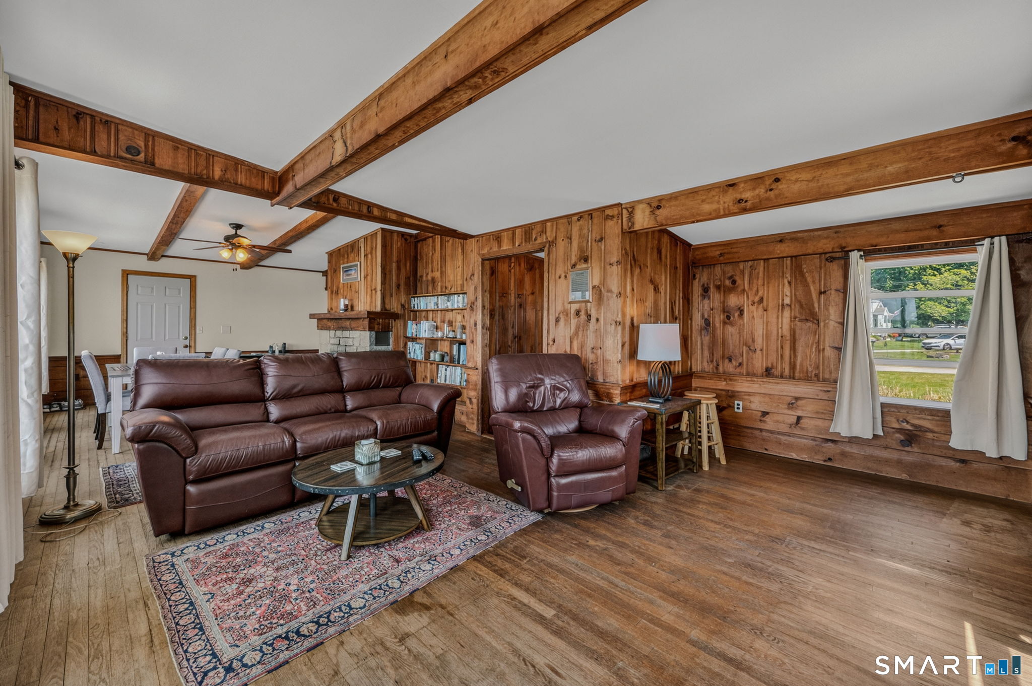 210 Shore Road Waterford, CT 06385 - Photo 15 of 26 a living room with furniture and a wooden floor