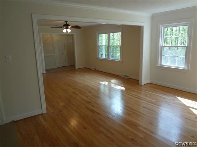 8074 Peaks Road Hanover, VA 23069 - Photo 3 of 28 an empty room with wooden floor and windows